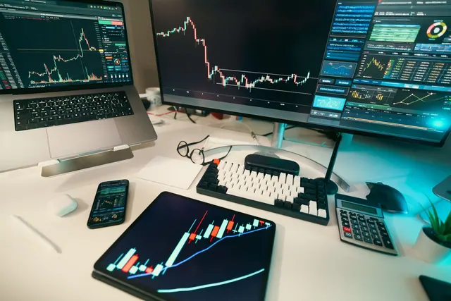 A modern trading desk with screens displaying financial charts and graphs, showcasing a digital analysis setup. Analytics foundations mistakes that can derail your plans