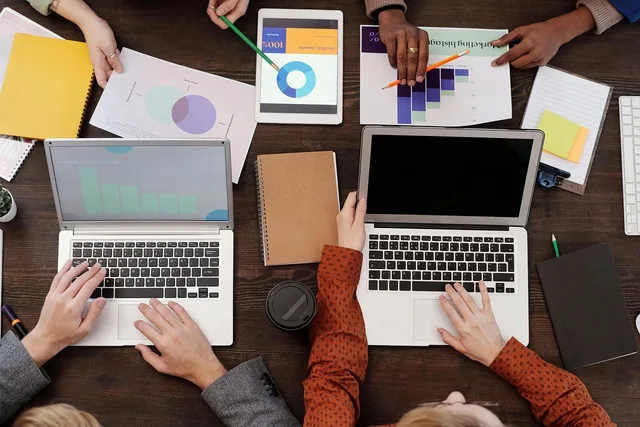 work meeting, notebook, charts, report, work desk, office, collaboration, ideas, discussion, planning, writing, teamwork, smart device, office tools, contemporary, business analysis, data, office paper, table. Which dashboard user adoption metrics predict a rebuild?